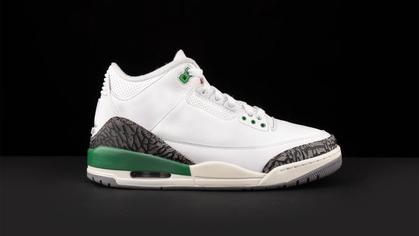 White shoe Crep Protect with green sole.