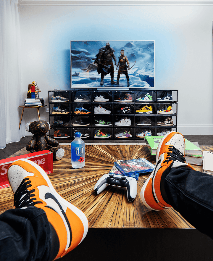 Man Sitting and Admiring His Sneakers Stored in Crep Protect 3.0 sneaker box