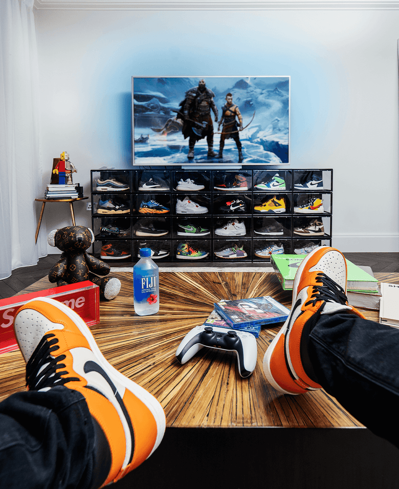 Man Sitting and Admiring His Sneakers Stored in Crep Protect 3.0 sneaker box
