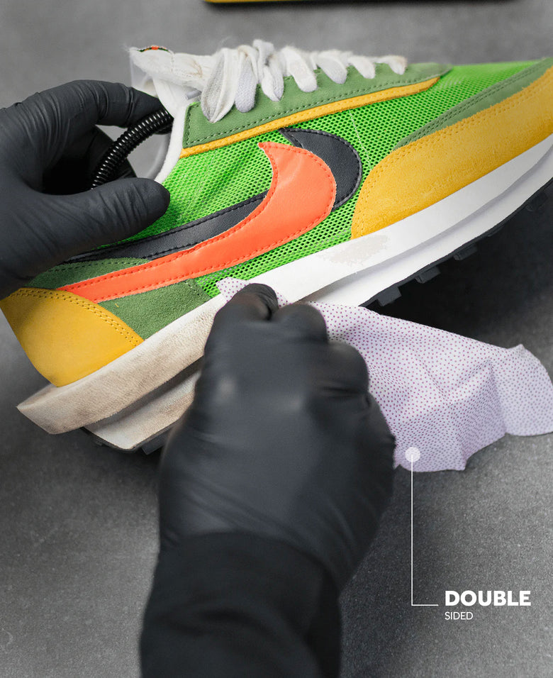 Man meticulously cleaning his sneaker with Crep Protect wipes