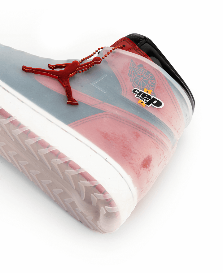 Red and black sneakers Crep Protect inside sneaker skins.